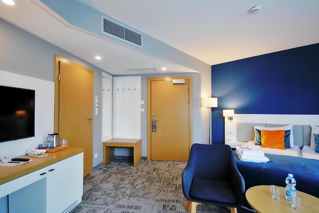 Una cama o camas en una habitación de Hotel Hel