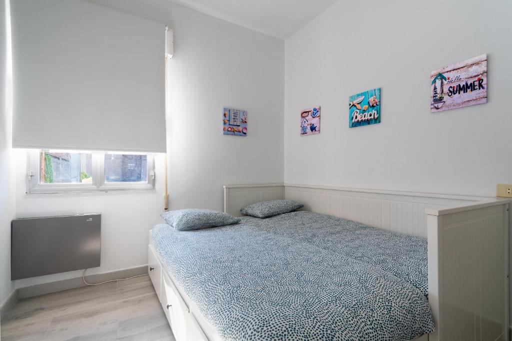 Postel nebo postele na pokoji v ubytování El Remanso de O Grove