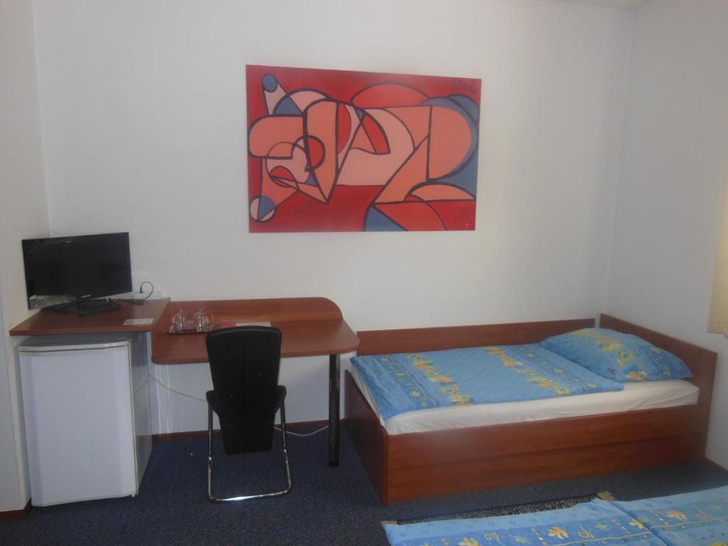 Postel nebo postele na pokoji v ubytování Hotel Pri Belokranjcu