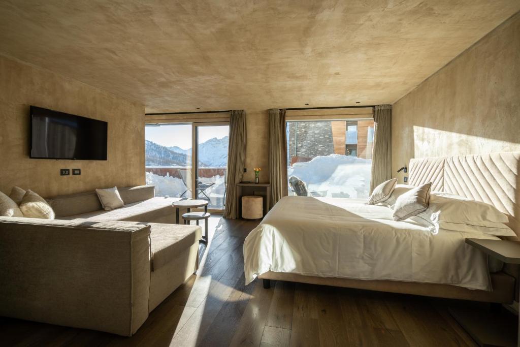 Postel nebo postele na pokoji v ubytování Bergman Mountain Hotel