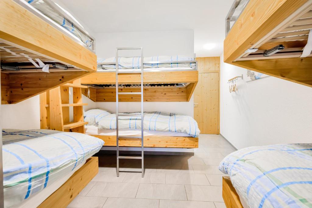 Postel nebo postele na pokoji v ubytování Hotel Restaurant Berghaus Malbun Buchserberg