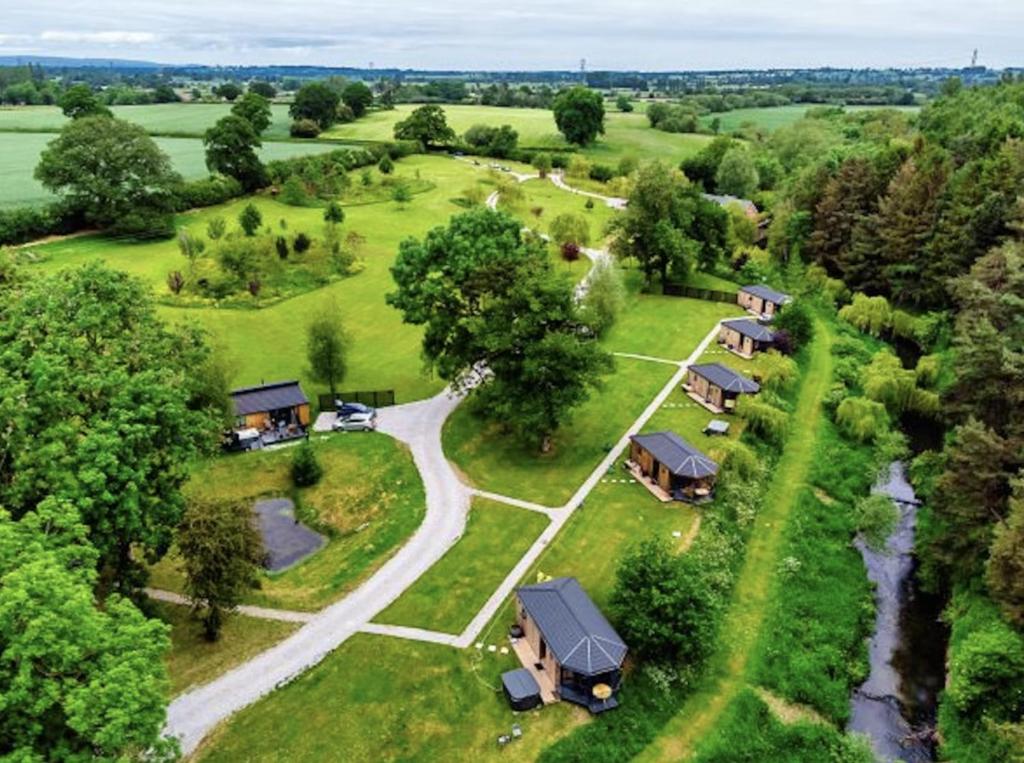 an aerial view of a group of cottages at Riverside Cabins in Shrewsbury