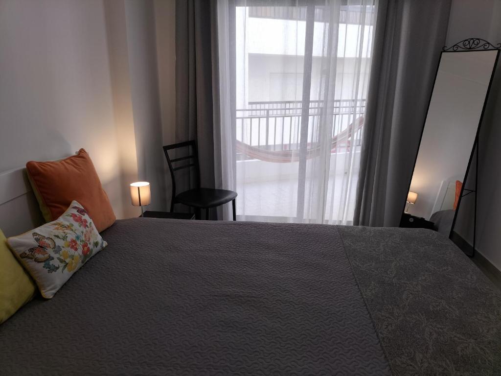 Ένα ή περισσότερα κρεβάτια σε δωμάτιο στο T2 Vista Atlantica 3 minutos da praia de Quarteira