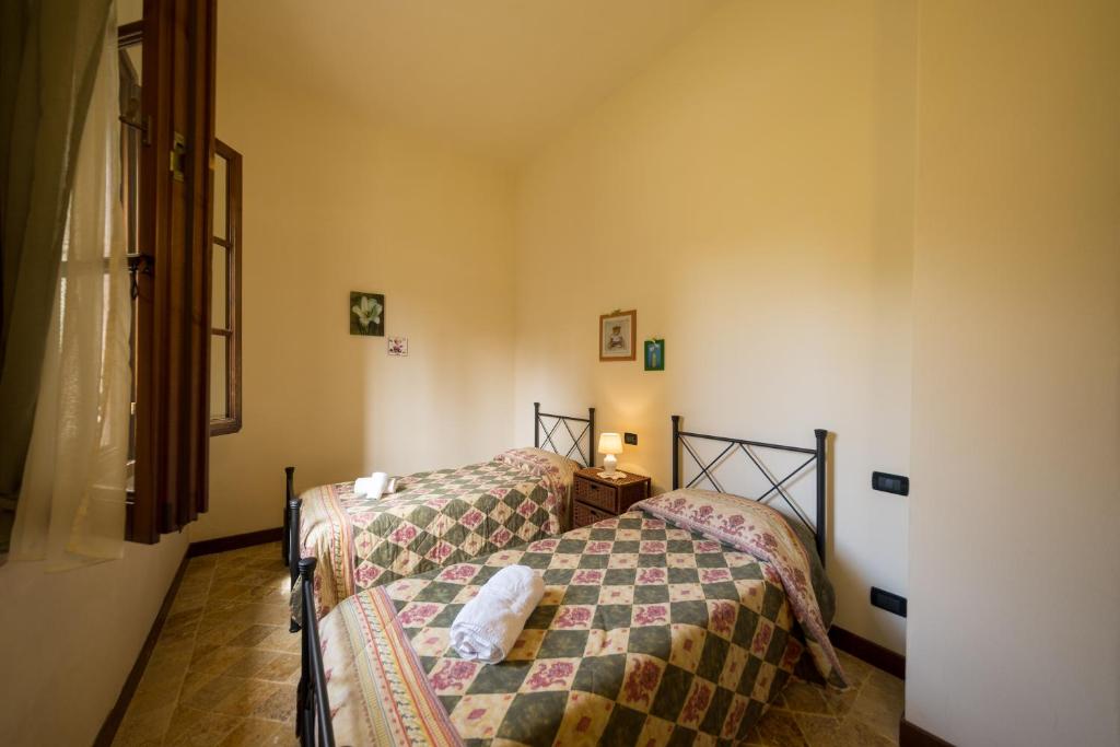 Postel nebo postele na pokoji v ubytování Agriturismo Due Ponti