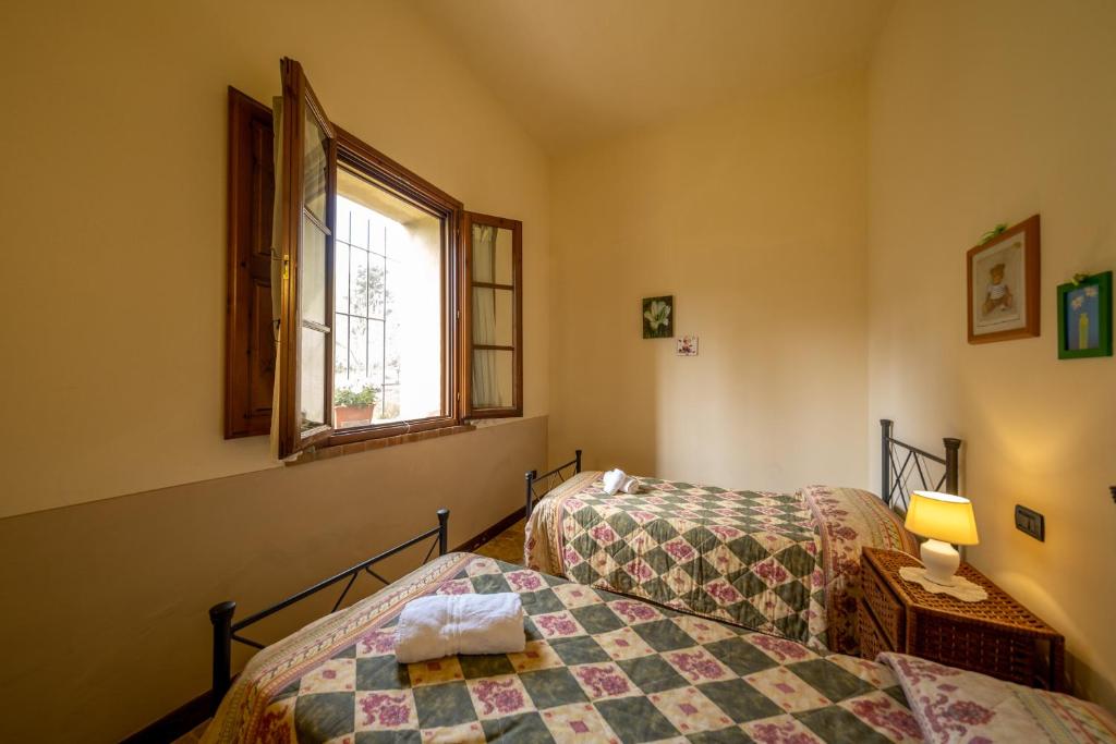 Postel nebo postele na pokoji v ubytování Agriturismo Due Ponti