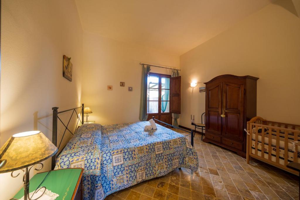 Postel nebo postele na pokoji v ubytování Agriturismo Due Ponti