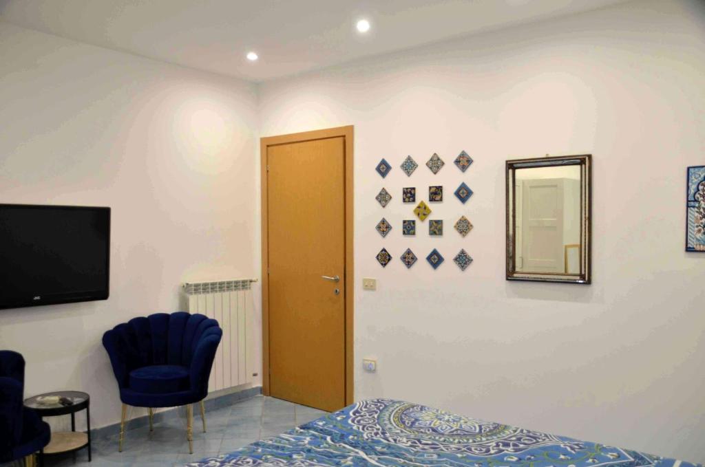 TV a/nebo společenská místnost v ubytování La Draghina B&B Capri