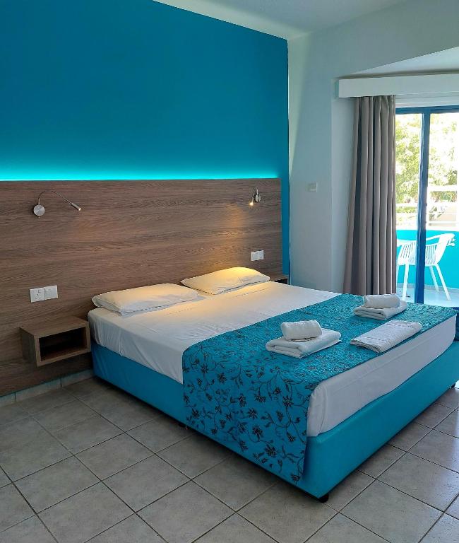 Postel nebo postele na pokoji v ubytování Lantiana Gardens ApartHotel