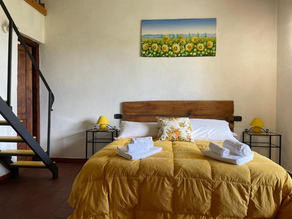 Postel nebo postele na pokoji v ubytování AgriHouse Orvieto