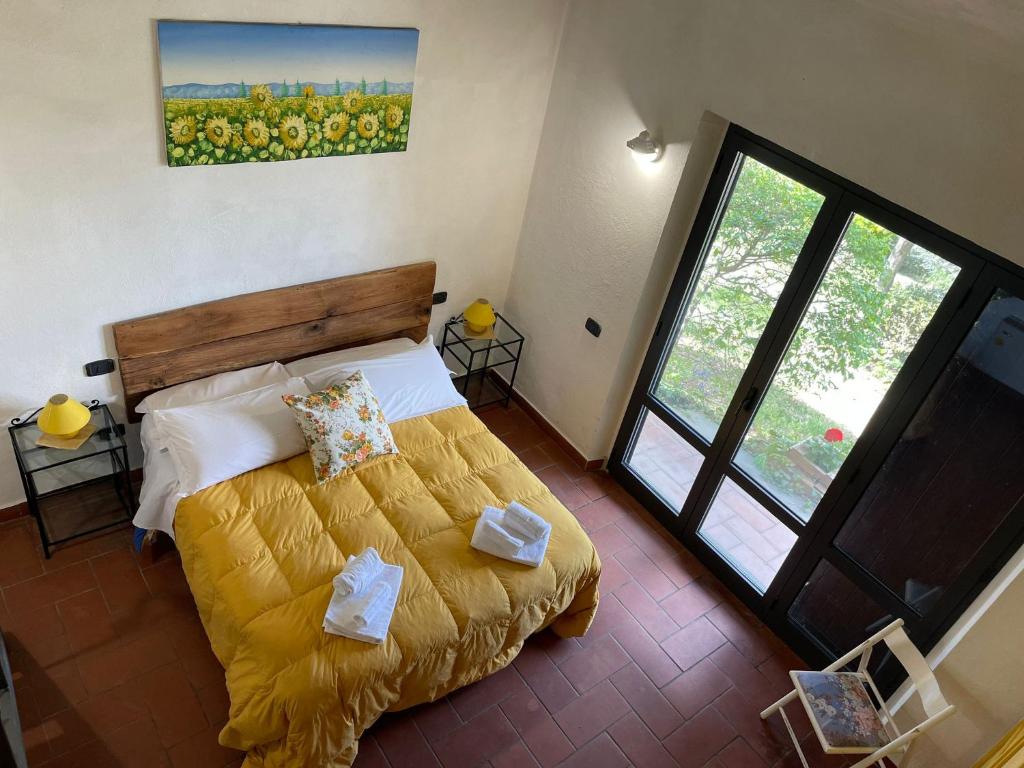 Postel nebo postele na pokoji v ubytování AgriHouse Orvieto