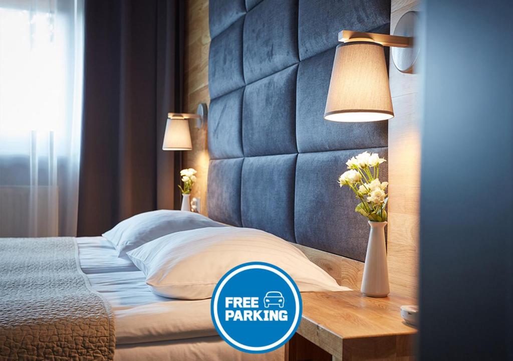 Postel nebo postele na pokoji v ubytování Hotel Batory