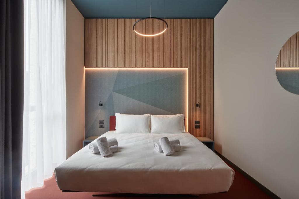 Letto o letti in una camera di 21 House of Stories Navigli