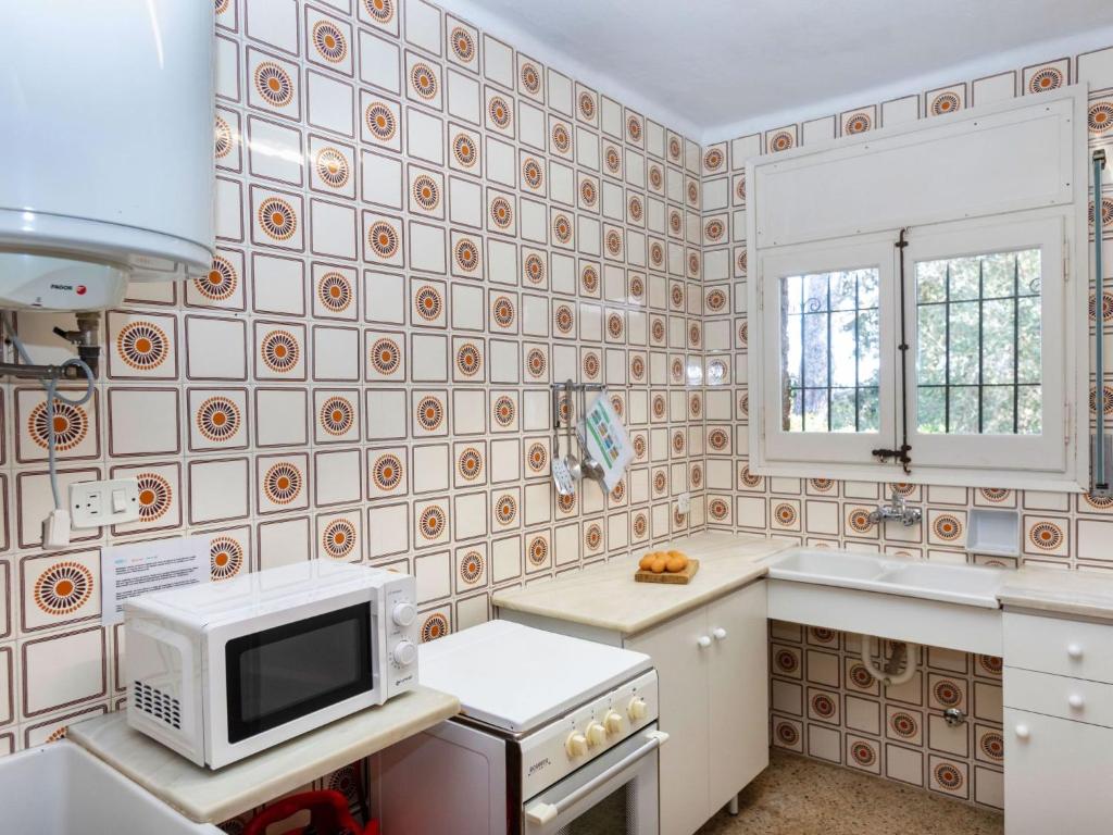 A kitchen or kitchenette at Apartment S'Esquirols Nº1 by Interhome
