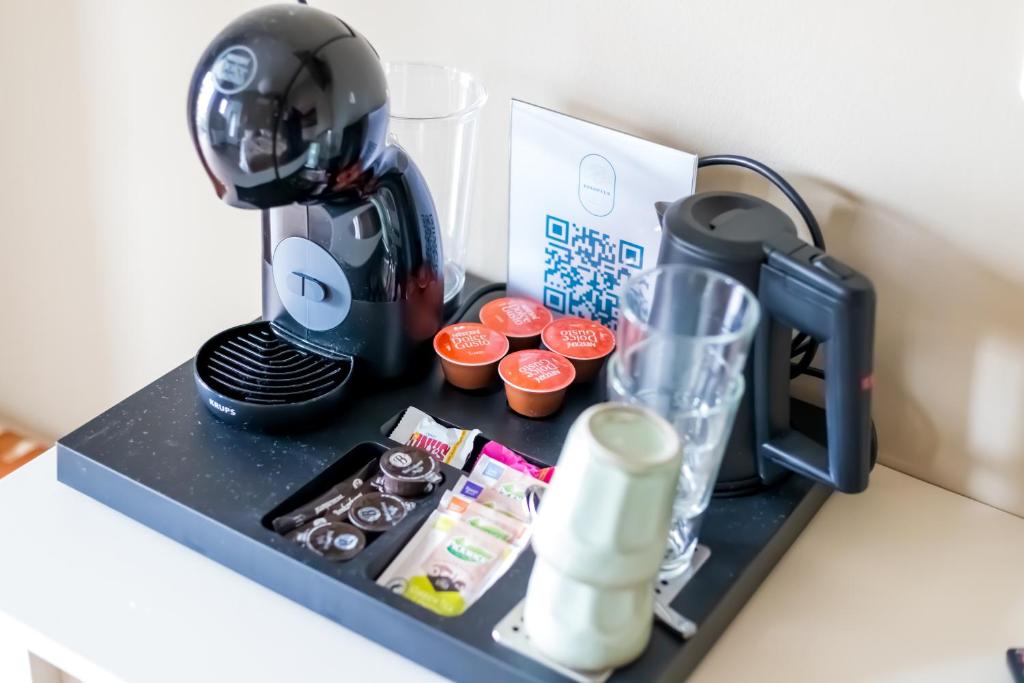 Hotel Restaurant Toxopeusにあるコーヒーまたはお茶