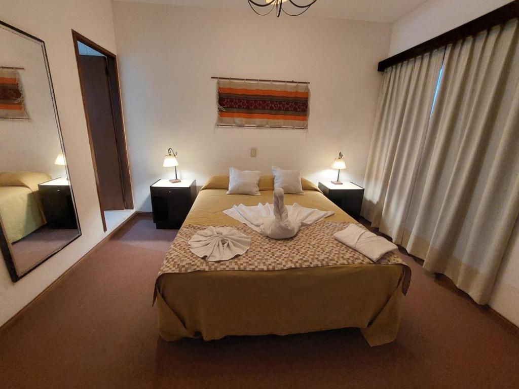 Postel nebo postele na pokoji v ubytování Grand Hotel by MH