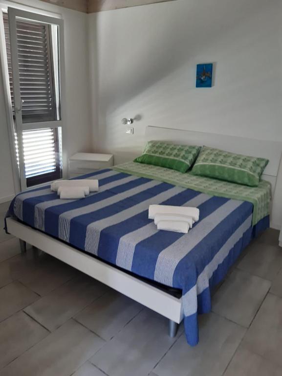 Postel nebo postele na pokoji v ubytování Casa azzurra