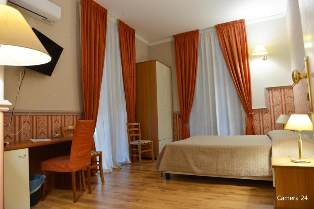 Posteľ alebo postele v izbe v ubytovaní Catania Centro Rooms