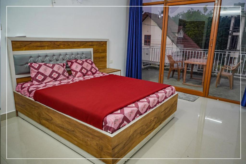 מיטה או מיטות בחדר ב-Dream Nest Villas Athirappilly