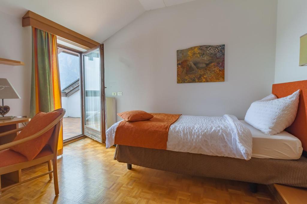 Postel nebo postele na pokoji v ubytování Hotel Arcobaleno