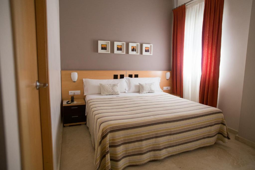 Ένα ή περισσότερα κρεβάτια σε δωμάτιο στο Hostal Don Julio