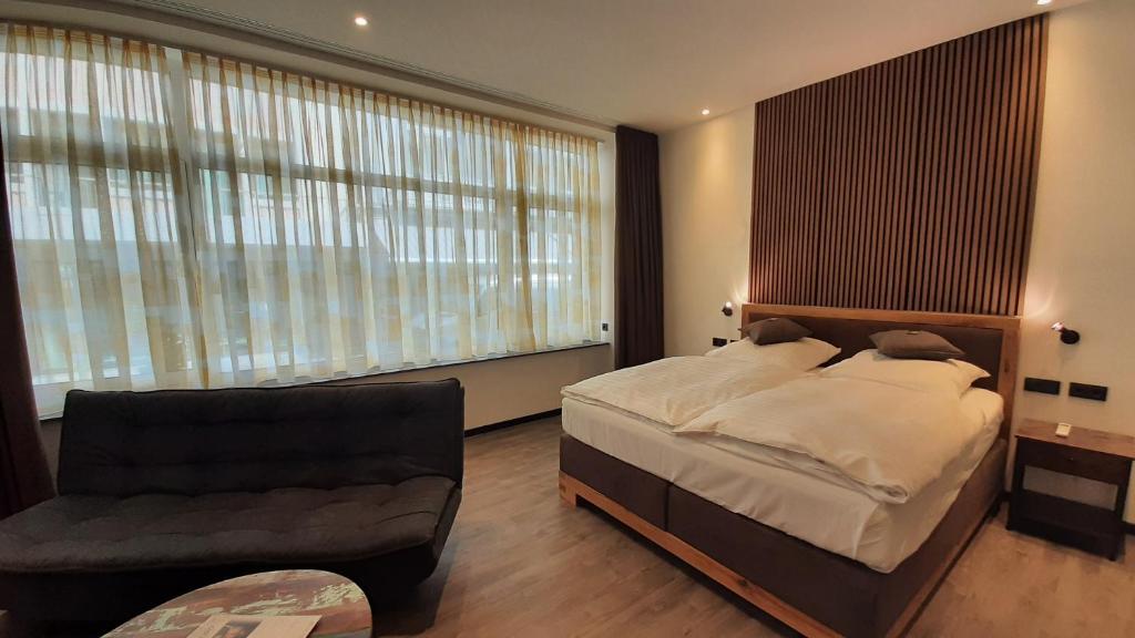 Postel nebo postele na pokoji v ubytování Hotel Krupp