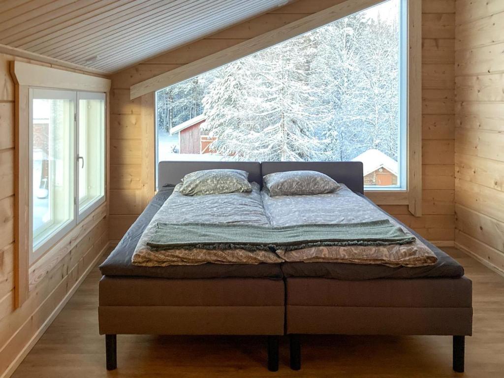 Cama ou camas em um quarto em Holiday Home Villa lehtoniemi by Interhome