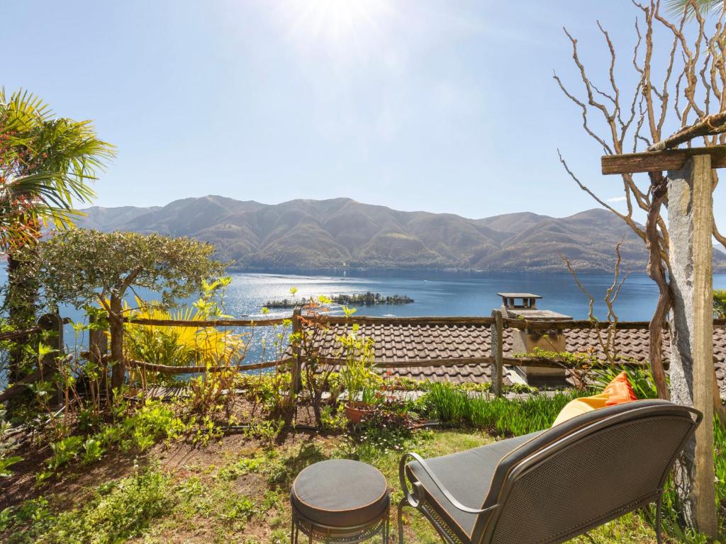 a patio with a view of the water and mountains at Apartment Vista Isole di Brissago by Interhome in Ronco sopra Ascona