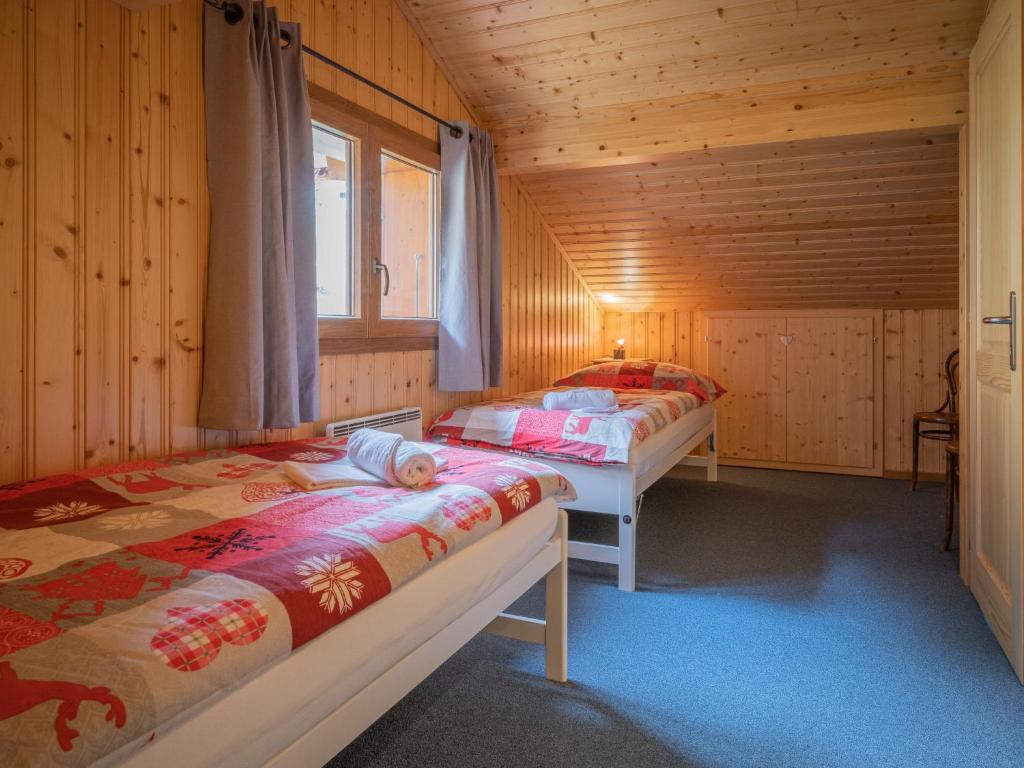 Postel nebo postele na pokoji v ubytování Chalet Coprin by Interhome