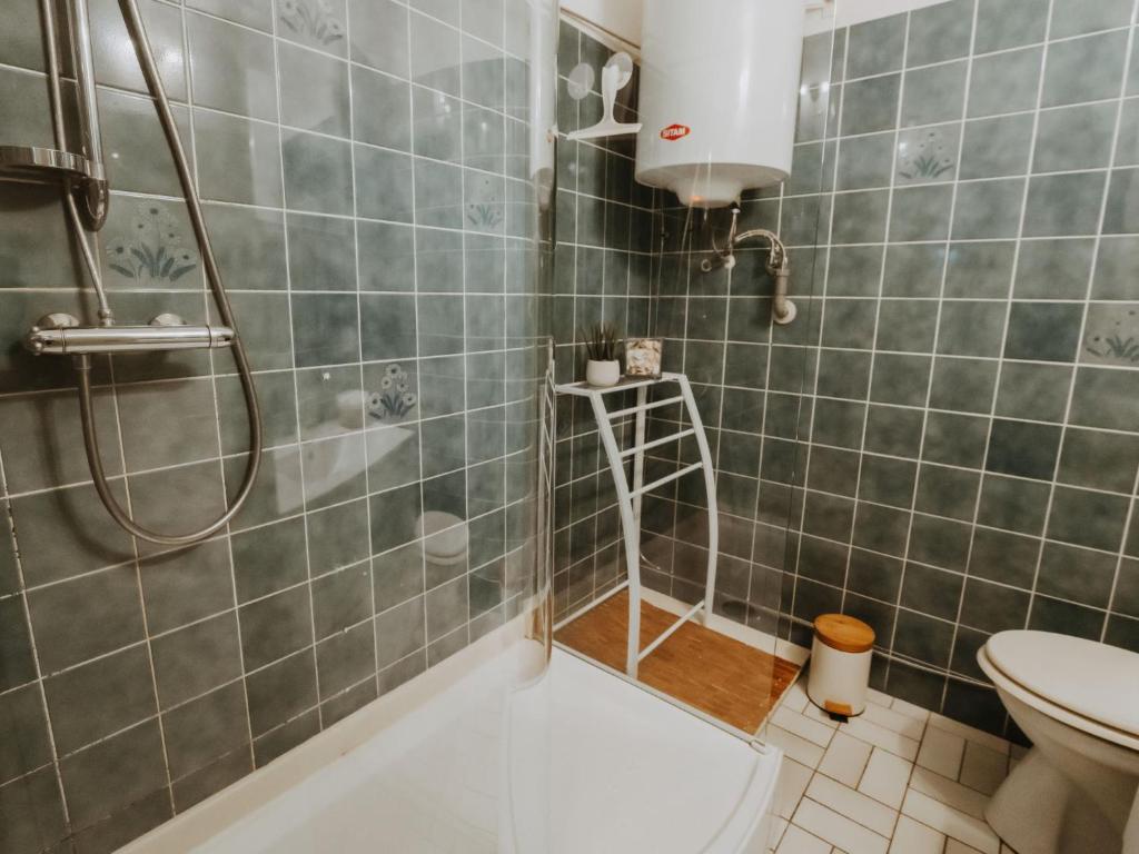 a bathroom with a shower and a toilet at Studio Zeeduin by Interhome in Bredene