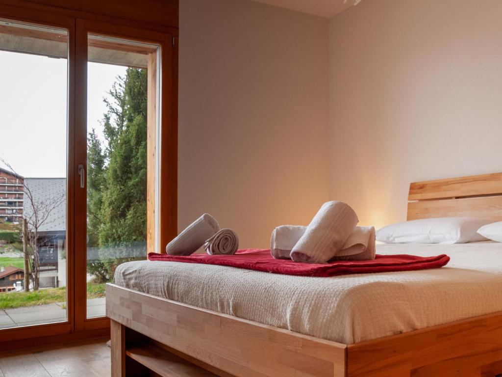 Postel nebo postele na pokoji v ubytování Apartment Ferme de Sandra E0 by Interhome