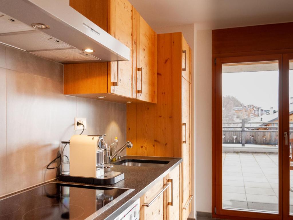 Kuchyň nebo kuchyňský kout v ubytování Apartment Ferme de Sandra E0 by Interhome