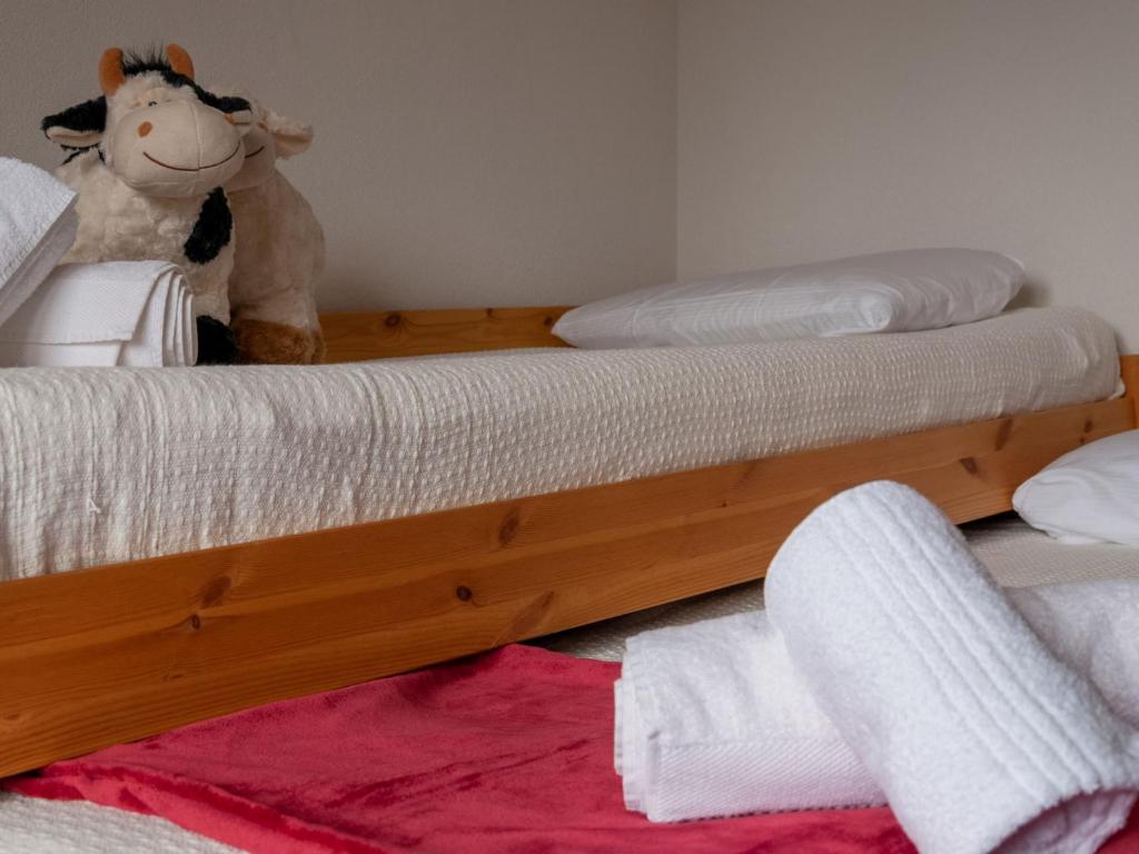 Postel nebo postele na pokoji v ubytování Apartment Ferme de Sandra E0 by Interhome