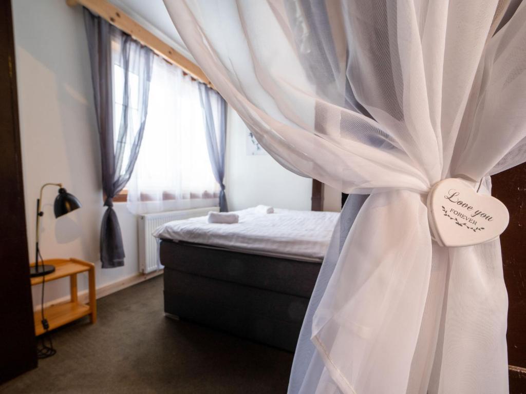 Postel nebo postele na pokoji v ubytování Chalet Krakonoš by Interhome