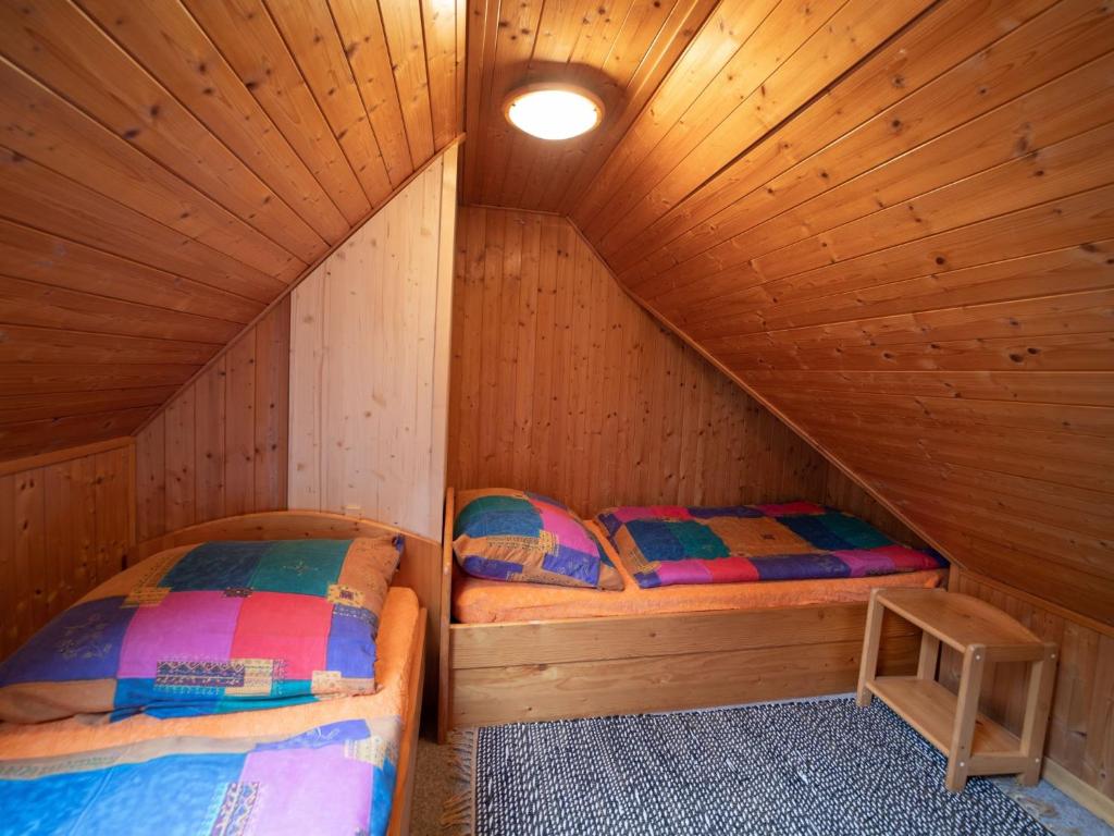 Postel nebo postele na pokoji v ubytování Chalet Krakonoš by Interhome