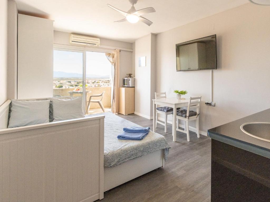 Televízia a/alebo spoločenská miestnosť v ubytovaní Studio Miami by Interhome
