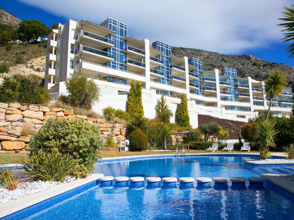 a large apartment building with a swimming pool at Apartment Jardines de Altea Hills-4 by Interhome in Altea