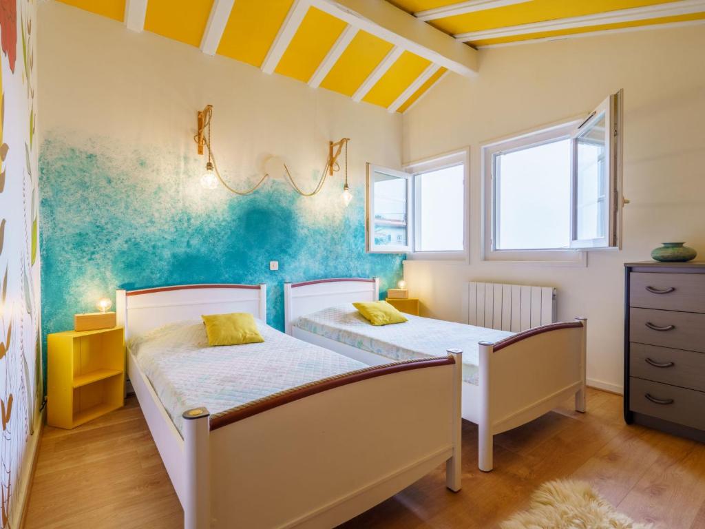Posteľ alebo postele v izbe v ubytovaní Holiday Home Milady II by Interhome