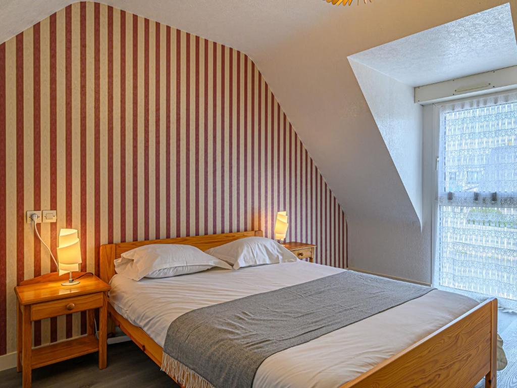 Łóżko lub łóżka w pokoju w obiekcie Holiday Home Le Ketch by Interhome
