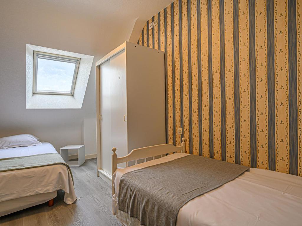 Łóżko lub łóżka w pokoju w obiekcie Holiday Home Le Ketch by Interhome