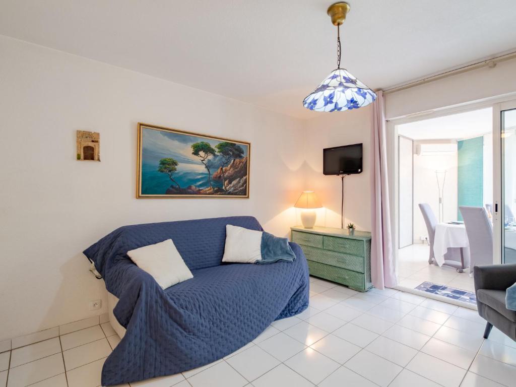 Televízia a/alebo spoločenská miestnosť v ubytovaní Apartment Le chant de la mer by Interhome