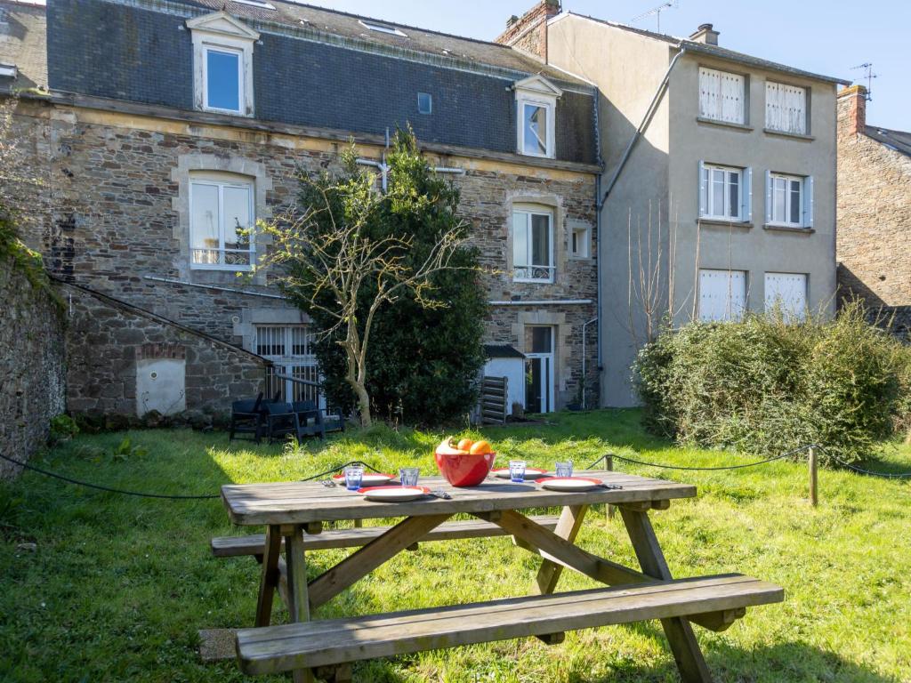 a picnic table in the yard of a house at Apartment Couleurs de la Baie by Interhome in Cancale