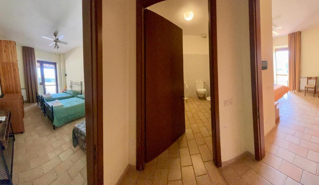 Postel nebo postele na pokoji v ubytování I Puntoni Agriturismo