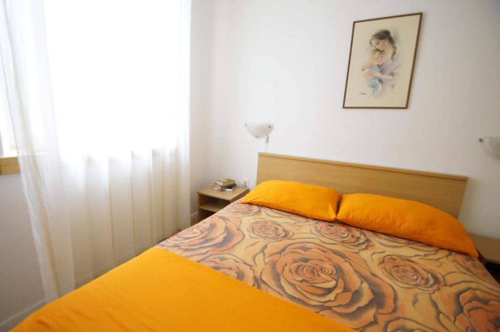 Postel nebo postele na pokoji v ubytování Apartments Ani