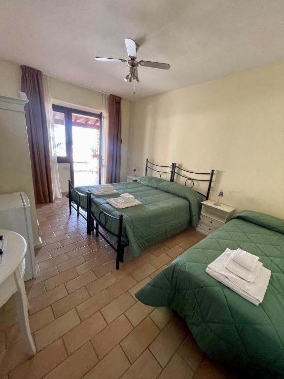 Postel nebo postele na pokoji v ubytování I Puntoni Agriturismo