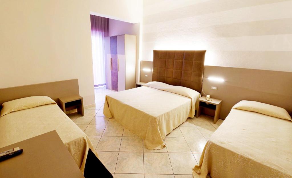 Postel nebo postele na pokoji v ubytování Hotel Fernanda