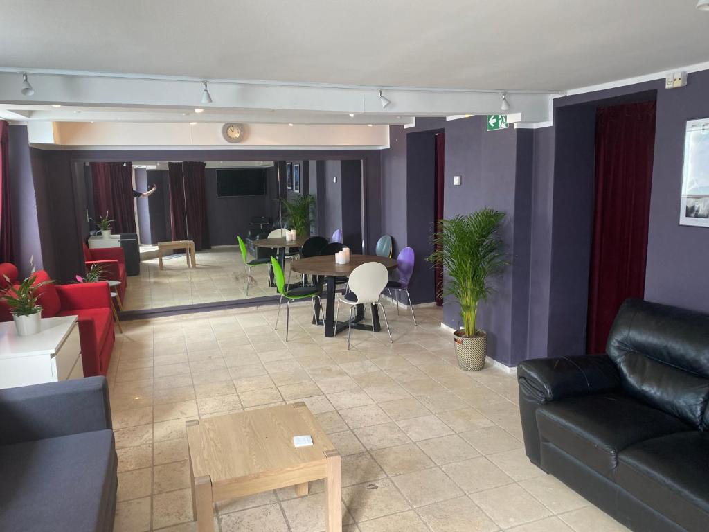 a living room with a couch and a table and chairs at Central Copenhagen Apartment in Copenhagen