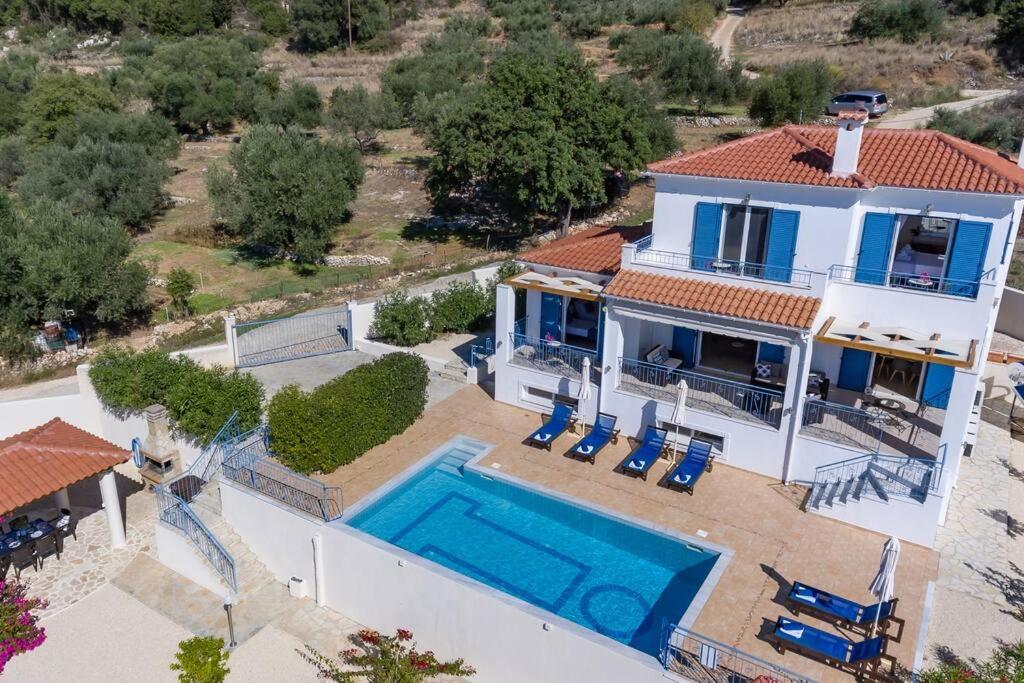 an aerial view of a house with a swimming pool at Villa Anna Margarita, beautiful modern villa with far reaching sea views in Kefallonia