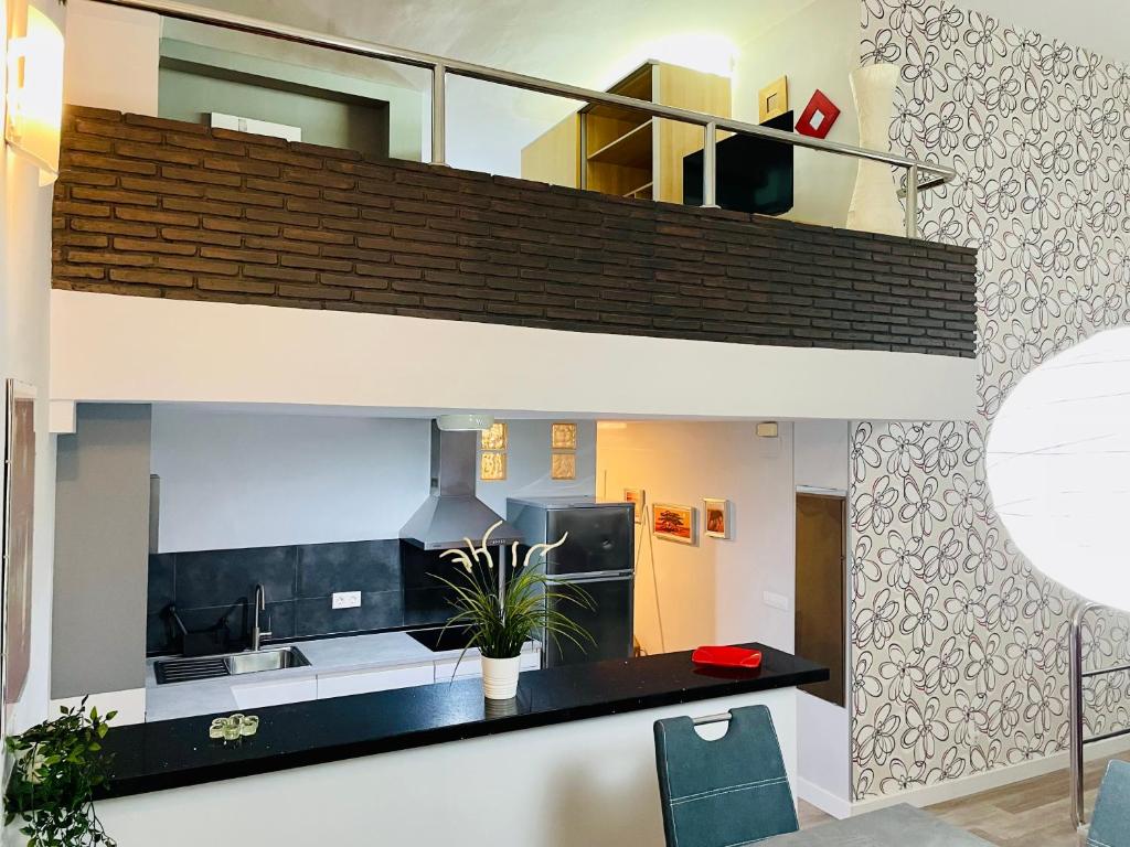Telewizja i/lub zestaw kina domowego w obiekcie Apartamento El Remo