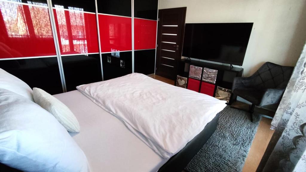 A bed or beds in a room at Penzion Ivka