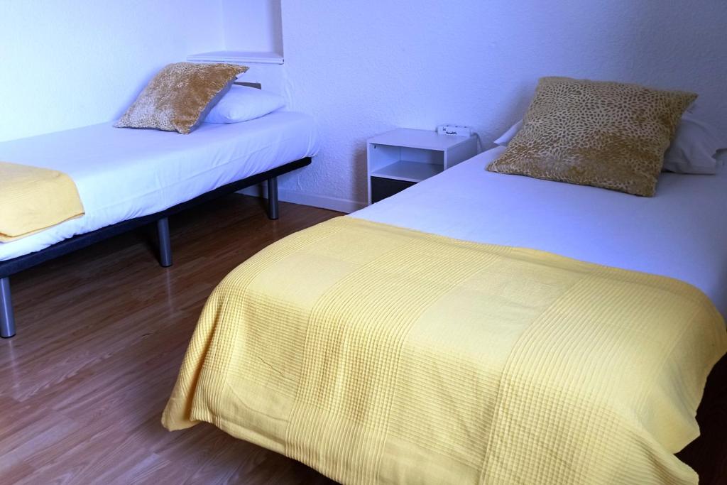 Postel nebo postele na pokoji v ubytování Le Neoulous